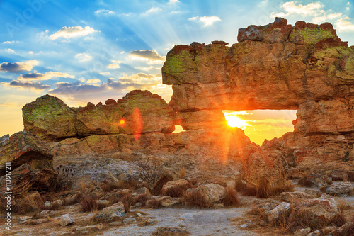 Sunset at the famous rock formation 'La Fenetre' near Isalo, Madagascar. 