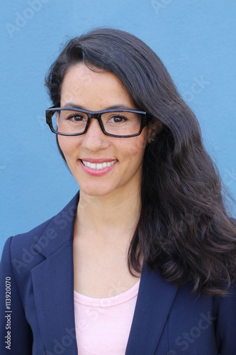 Young smiling business woman in black glasses isolated on blue background
