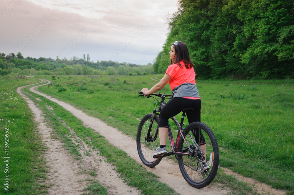 A girl riding a bike A girl riding a bike