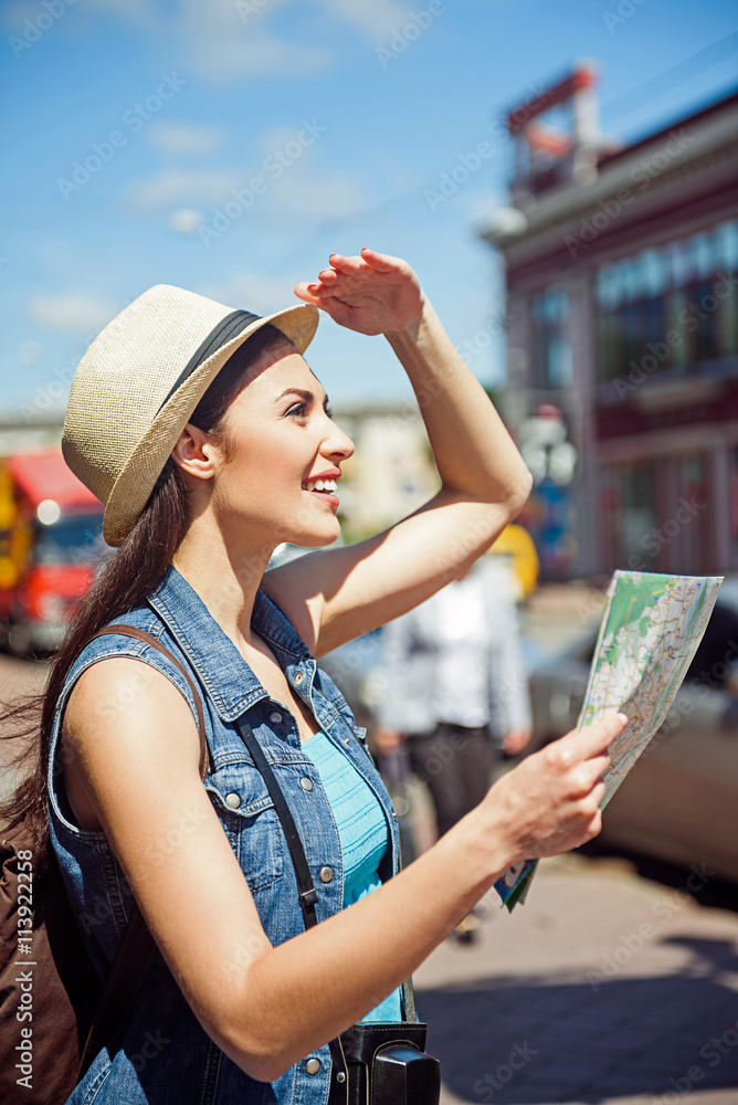 Curious young woman making journey in city