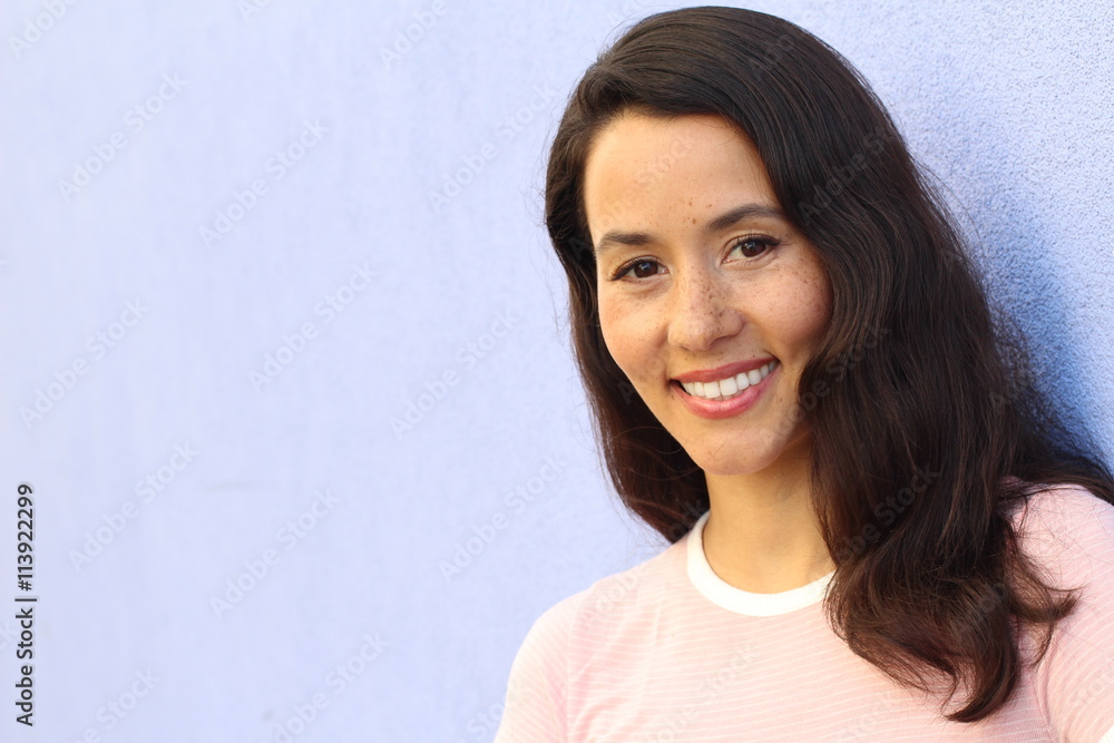 Portrait of a young Hispanic female smiling with copy space
Portrait of a young Hispanic female smiling with copy space