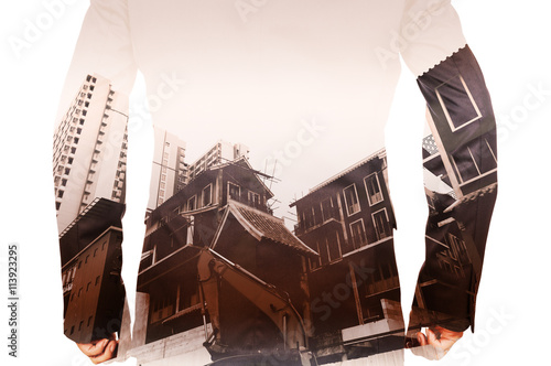 Double exposure of Business Man and Power Crane in the City as C