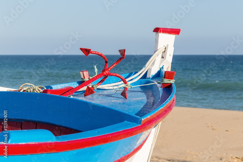 Traditional Portuguese boat on the beach.