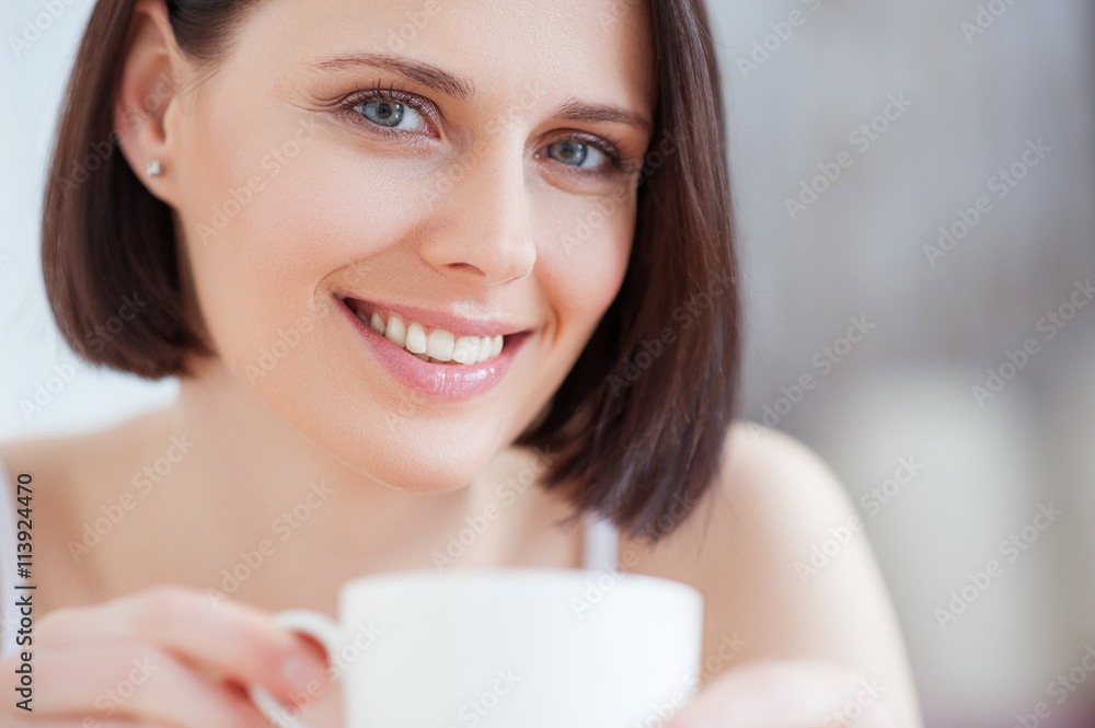 Attractive woman having coffee at home Attractive woman having coffee at home