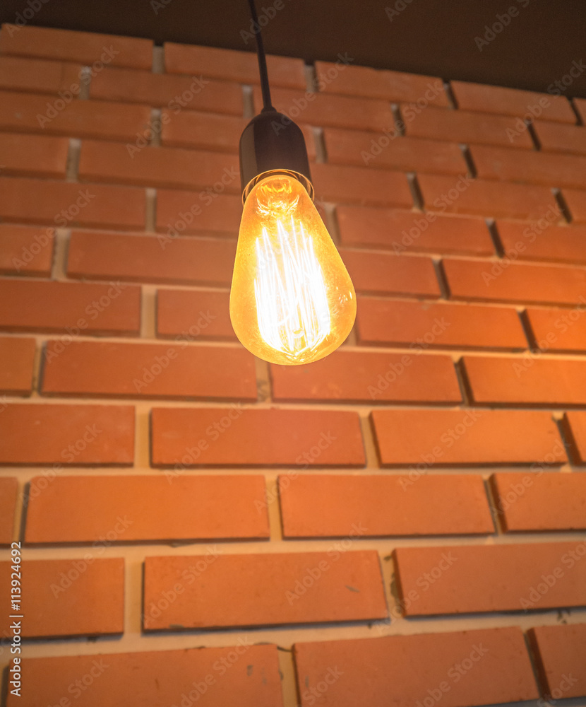 Light bulbs and brick wall background 