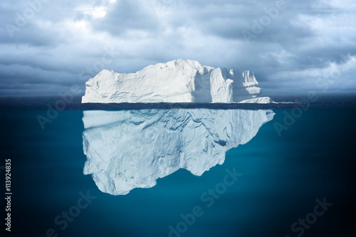 Iceberg Mostly Underwater Floating in Ocean © oporkka