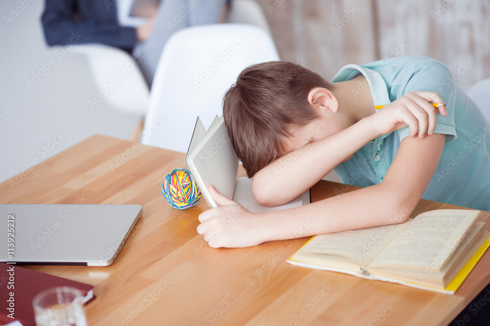 Boy sleeping on book Boy sleeping on book
