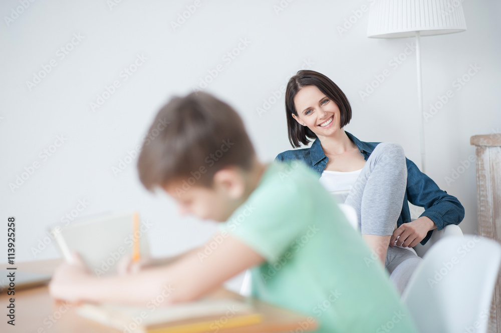 Young teenage boy studying at desk Young teenage boy studying at desk