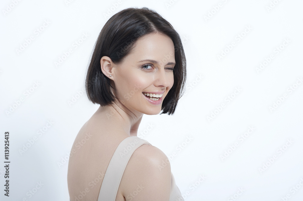 Beautiful young woman posing in dress