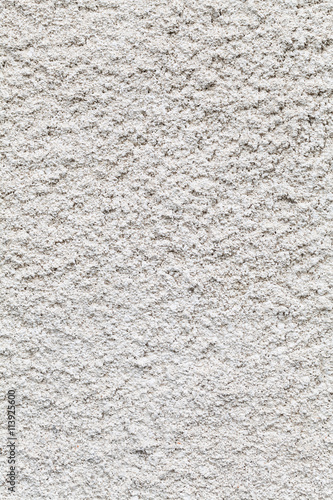 White roughcast lime mortar plaster wall background texture on an old building made from sand and lime in the original tradition photo