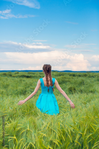 Wallpaper Mural Beauty Romantic Girl Outdoors. Beautiful Teenage Model girl in blue Casual Short Dress on the Field in Sun Light. Blowing Long Hair. summer. Glow Sun, Sunshine. Torontodigital.ca
