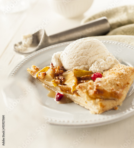 Individual portion of fruit galette with ice cream