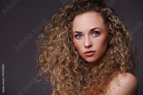 Portrait of woman with curly hair