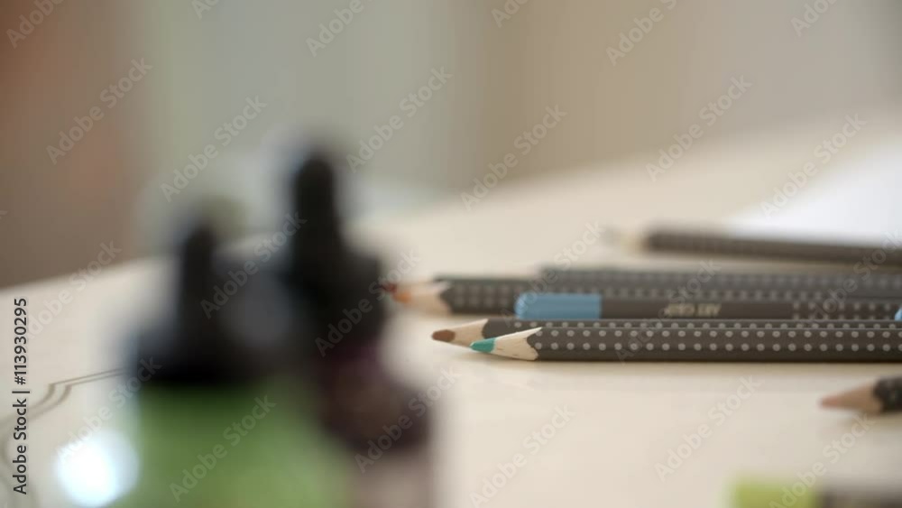 Pencils and bottles with ink for drawing on the table slide camera stock footage Pencils and bottles with ink for drawing on the table slide camera stock footage