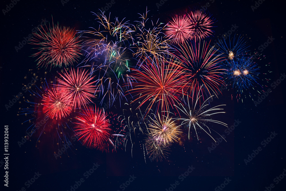 Beautiful celebration golden, red, blue sparkling fireworks over