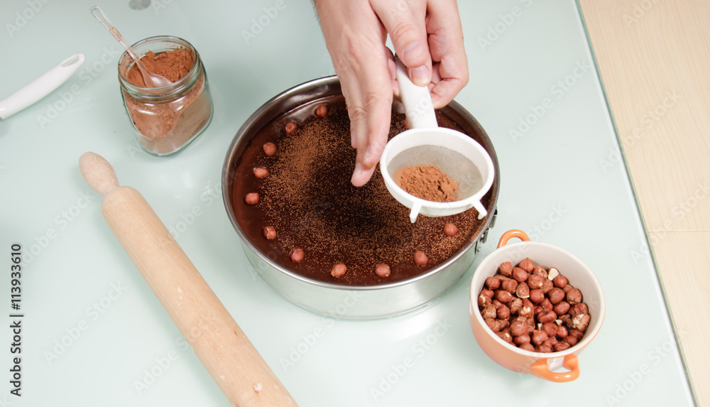 Hand decorating cake elevated view Hand decorating cake elevated view