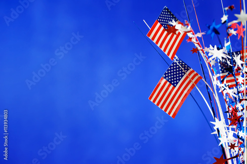 4th of July decorations on blue background photo