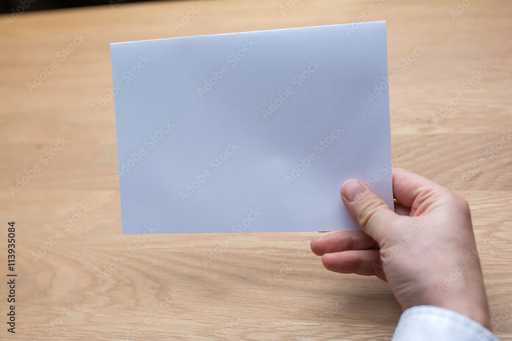 businessman holding white blank paper businessman holding white blank paper