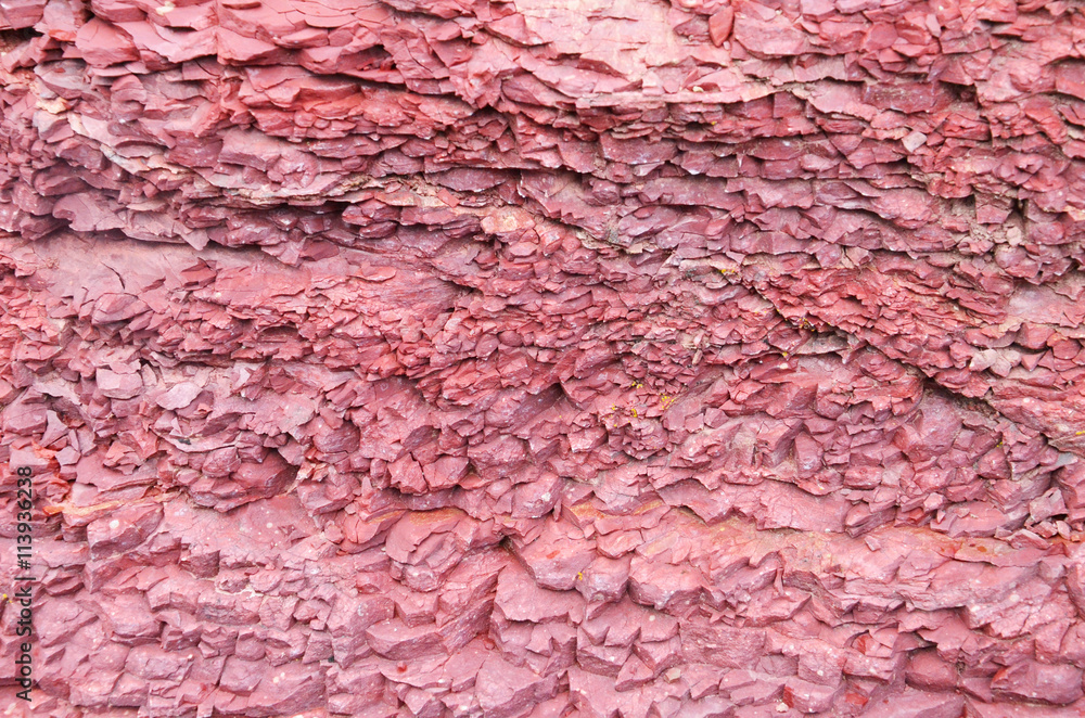 Naklejka premium Carcked red rock surface limestone texture