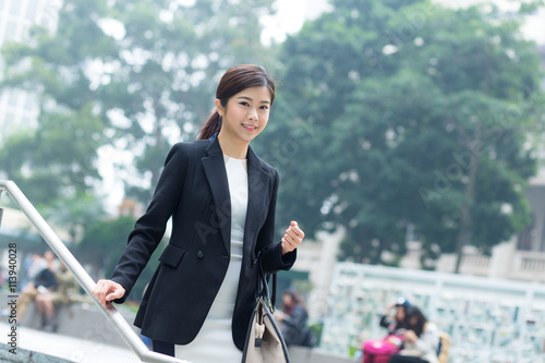 Business woman walkiing at outdoor © leungchopan