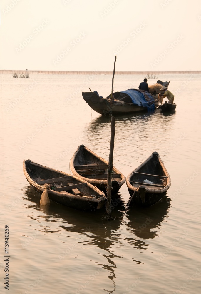 Wooden boats at Tam Giang Lagoon, Hue province, Vietnam Wooden boats at Tam Giang Lagoon, Hue province, Vietnam