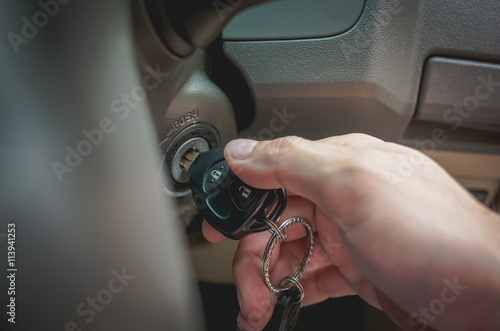 switch a car key on to start the engine