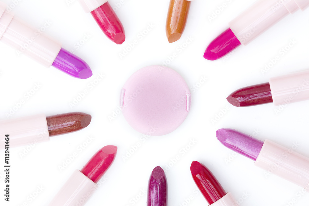 pink makeup puff and various colors lipsticks pink makeup puff and various colors lipsticks