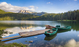 Durmitor National Park, Montenegro,sunrise over a mountain lake, the peaks of the mountains lit by the rising sun