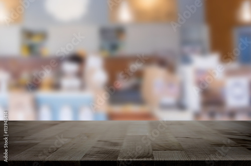 Selected focus empty brown wooden table and space of Coffee shop