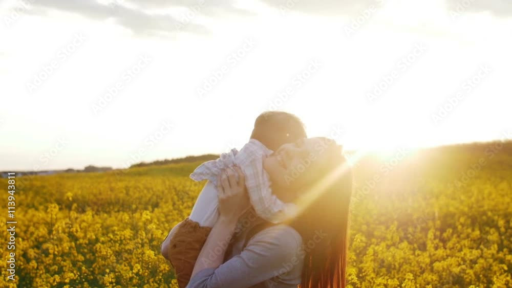 mother plays with son at field at sunset. Slow mo mother plays with son at field at sunset. Slow mo