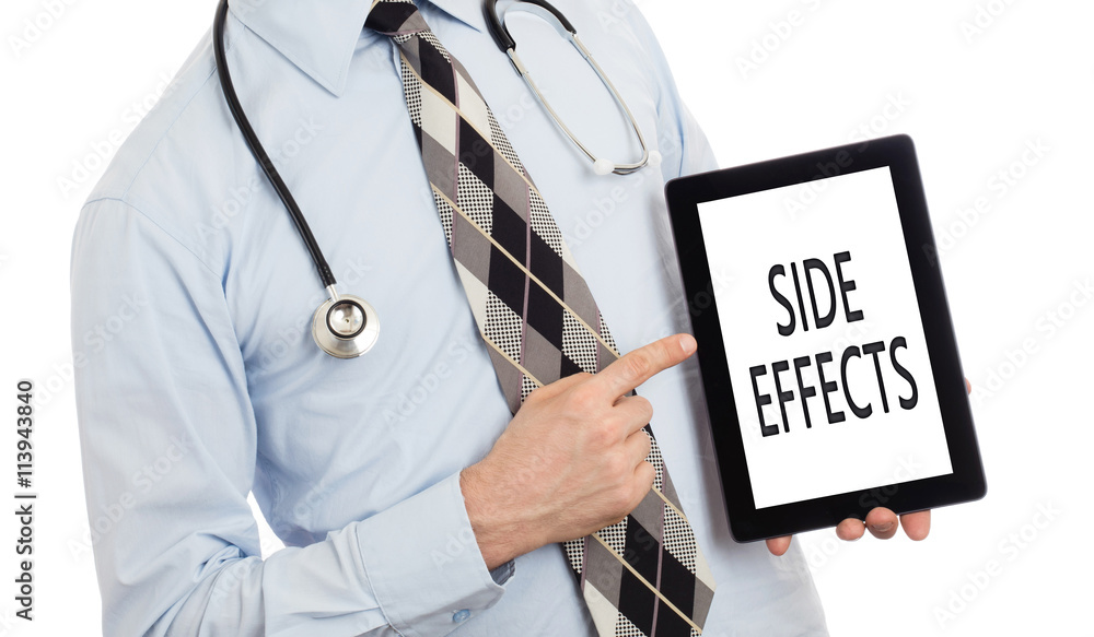 Doctor holding tablet - Side effects
