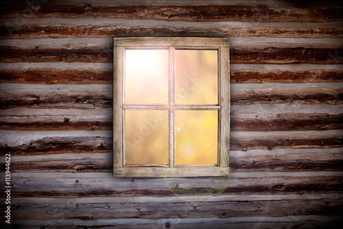 Bild auf Leinwand Morning light through cabin window