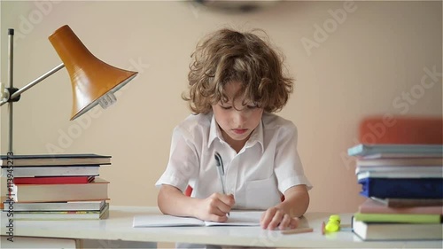 A child of primary school age do homework. Boy did homework and went for a walk