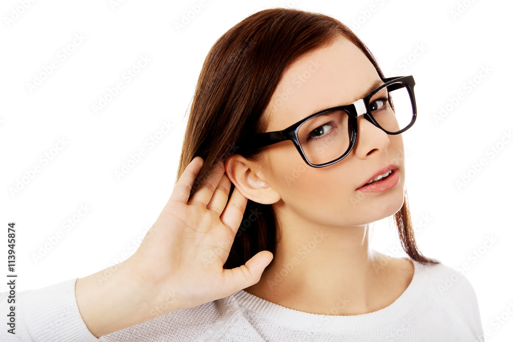 Shocked young woman overhearing a conversation Shocked young woman overhearing a conversation