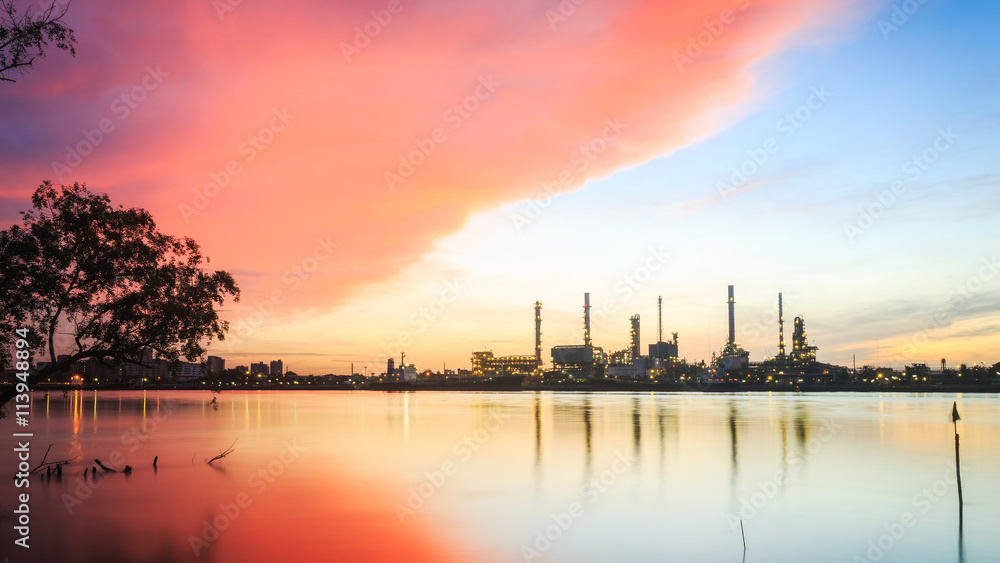 Oil refinery plant at dusk. (Siluate scene)