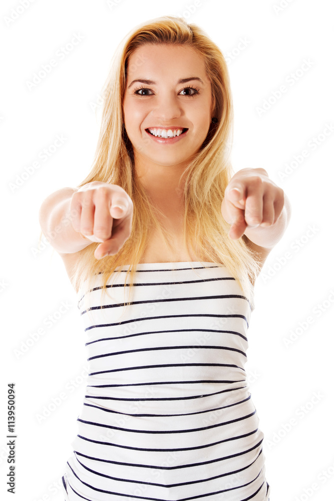 Blond girl pointing ahead, white background. Blond girl pointing ahead, white background.