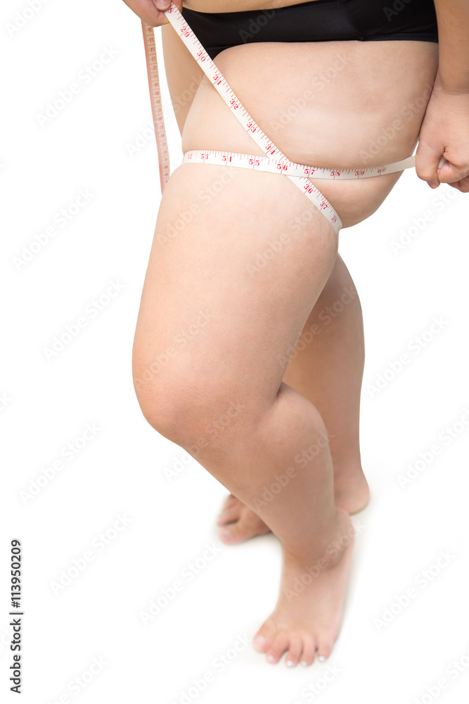 fat woman show and squeeze tighten, leg body fat by measure tape Stock  Photo