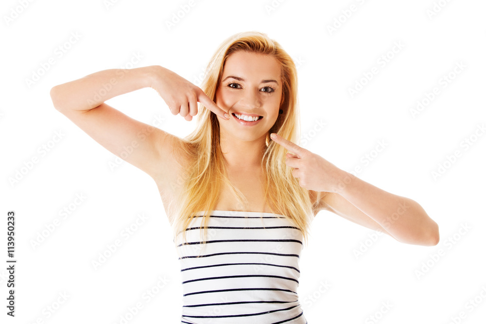 Woman showing her perfect straight white teeth. Woman showing her perfect straight white teeth.