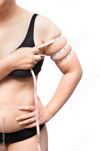 fat woman show and  squeeze tighten, arm body fat by measure tape weight loss concept