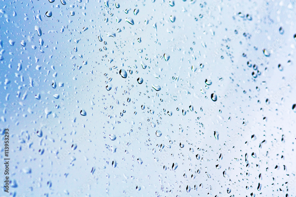 Stream of water in heavy rain. Raindrops on window pane. Blur effect. Stream of water in heavy rain. Raindrops on window pane. Blur effect.