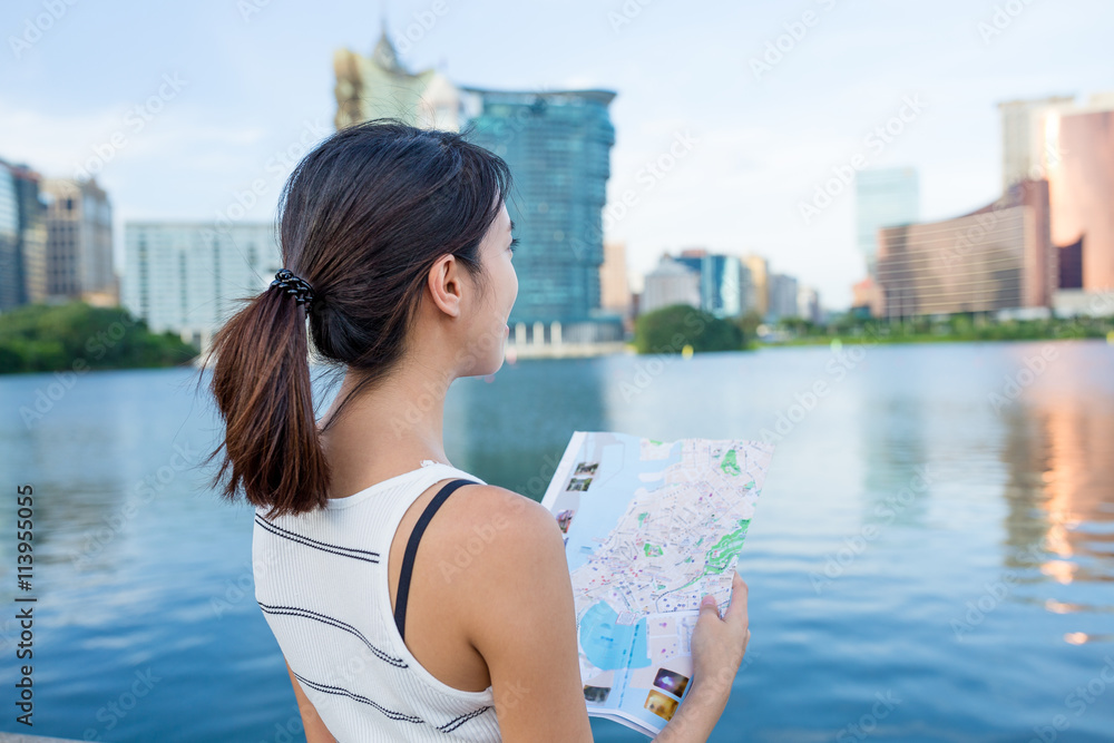 Woman looking for location in Macau