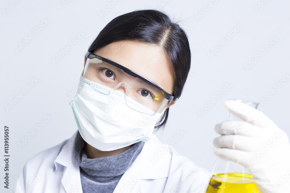 Woman Sciencetist: Researcher Holding at a Liquid Solution on Is Woman Sciencetist: Researcher Holding at a Liquid Solution on Is