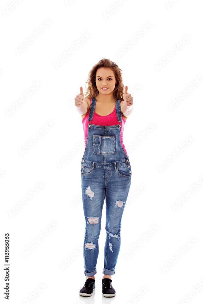 Young happy woman showing thumbs up Young happy woman showing thumbs up
