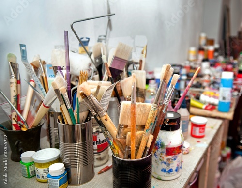 Brushes and paints in the artist's Studio.