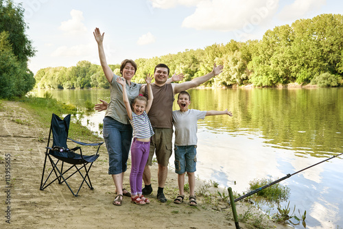 family camping and fishing, river and forest, summer season