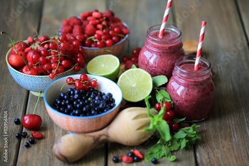 Smoothie with strawberries, blueberries in jars