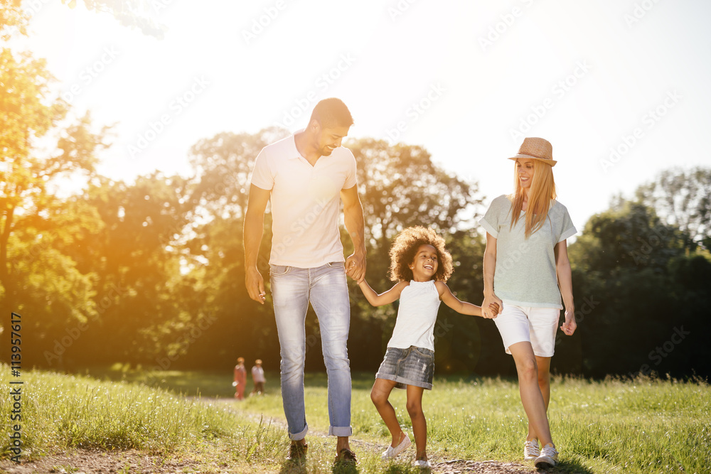 Fototapeta premium Beautiful faimly taking a walk in nature