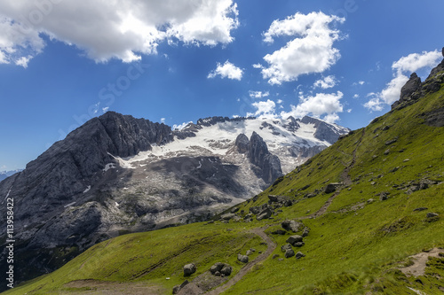 The path climbs with views of the snow-capped peaks