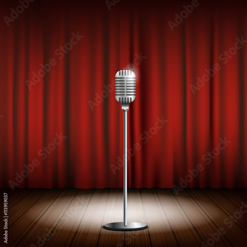 Metal chrome retro microphone on a stand. Scene with a red curta