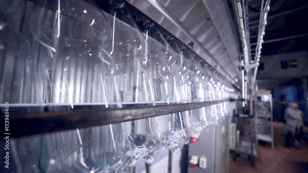 Modern clean Production line of carbonated drinks. Empty plastic ...
